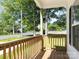Cozy covered porch with wooden railing and plenty of natural light at 803 Blackmon St, Rock Hill, SC 29730
