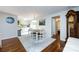 Open dining room with hardwood floors, a large rug, and access to the adjacent kitchen space at 846 Gist Rd, Rock Hill, SC 29732