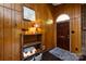 Inviting entryway featuring wood paneling, stylish decor, and a patterned rug at 846 Gist Rd, Rock Hill, SC 29732