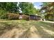 View of a single story home with wood siding and colorful landscaping at 846 Gist Rd, Rock Hill, SC 29732