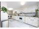 The kitchen is equipped with white cabinets, a microwave, and a matching stove oven at 846 Gist Rd, Rock Hill, SC 29732
