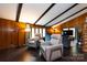 Comfortable living room with wood paneling, beamed ceilings, and modern furniture at 846 Gist Rd, Rock Hill, SC 29732