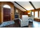 Inviting living room with a brick fireplace, wood paneling, and comfortable seating at 846 Gist Rd, Rock Hill, SC 29732