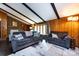 Cozy living room with fireplace, built in bookshelf, wood paneling and beamed ceiling at 846 Gist Rd, Rock Hill, SC 29732