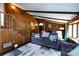 Spacious living room featuring wood paneling, stairs, and comfortable furniture at 846 Gist Rd, Rock Hill, SC 29732