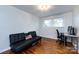 Office featuring a futon, desk setup, and bright natural light from the window at 846 Gist Rd, Rock Hill, SC 29732