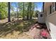 A large, lush backyard surrounded by mature trees offers privacy and natural beauty to the property at 880 Legion Club Rd, Salisbury, NC 28146