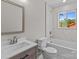 A recently renovated bathroom with a tiled shower/tub, new vanity, and fixtures at 880 Legion Club Rd, Salisbury, NC 28146
