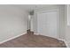 Spacious bedroom features hardwood floors and a large closet with bi-fold doors at 880 Legion Club Rd, Salisbury, NC 28146