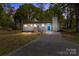 Charming single-story home with a brick chimney and a well-maintained lawn at 880 Legion Club Rd, Salisbury, NC 28146