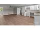 Modern kitchen with white cabinets and granite countertops adjacent to a living area at 880 Legion Club Rd, Salisbury, NC 28146