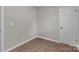 A room with luxury vinyl plank flooring, fresh paint, and standard electrical outlets at 880 Legion Club Rd, Salisbury, NC 28146