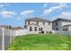 Spacious backyard with well-maintained lawn, privacy fence, and patio set at 9102 Buckley Ct, Charlotte, NC 28269