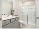 Modern bathroom with a glass-enclosed shower, vanity, and neutral color palette at 9102 Buckley Ct, Charlotte, NC 28269