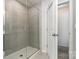 Tiled bathroom showing glass shower stall at 9102 Buckley Ct, Charlotte, NC 28269