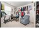 Bedroom with a desk, exercise bike, armchair, and decorative sports memorabilia at 9102 Buckley Ct, Charlotte, NC 28269