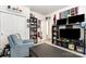 Bedroom with a comfortable armchair, television, and shelving at 9102 Buckley Ct, Charlotte, NC 28269