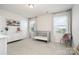 Bedroom with crib, dresser, and two windows with plenty of natural light at 9102 Buckley Ct, Charlotte, NC 28269