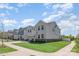 Attractive two-story home boasts manicured lawn, charming balcony, and attached two-car garage at 9102 Buckley Ct, Charlotte, NC 28269