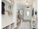 Inviting foyer featuring a white front door, coat rack, and console table, creating a welcoming entrance at 9102 Buckley Ct, Charlotte, NC 28269