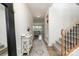 Bright foyer with hardwood floors, a decorative console table, staircase and view to the living room at 9102 Buckley Ct, Charlotte, NC 28269