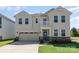 Inviting two-story home with a well-manicured lawn and a charming covered front porch at 9102 Buckley Ct, Charlotte, NC 28269