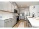 Stylish kitchen with stainless steel appliances, gray cabinets, and quartz countertops, perfect for cooking at 9102 Buckley Ct, Charlotte, NC 28269