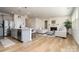 Spacious living room with a fireplace, plush seating, and an open layout leading to the kitchen at 9102 Buckley Ct, Charlotte, NC 28269