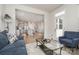 Spacious open-concept living room and kitchen area, featuring hardwood floors and modern decor at 9102 Buckley Ct, Charlotte, NC 28269