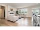 Cozy living room featuring a fireplace, a comfortable sofa, and ample natural light through large windows at 9102 Buckley Ct, Charlotte, NC 28269