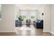 Cozy living room filled with natural light, featuring hardwood floors and neutral paint at 9102 Buckley Ct, Charlotte, NC 28269
