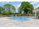 Community pool featuring a pool deck, mature trees and landscaping at 9102 Buckley Ct, Charlotte, NC 28269