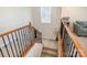 Carpeted staircase with decorative wooden railing at 9102 Buckley Ct, Charlotte, NC 28269