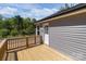 Side view of a new wooden deck with stairs offering seamless outdoor access from the house at 104 Cleveland Ave, Albemarle, NC 28001