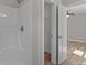 Bright bathroom featuring a shower and walk-in closet with modern fixtures and a neutral color palette at 104 Cleveland Ave, Albemarle, NC 28001