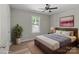 Bright bedroom featuring decor, wood-look floors, and a window with natural light at 104 Cleveland Ave, Albemarle, NC 28001