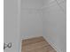 Interior of a walk-in closet with wire shelving and light-colored wood flooring at 104 Cleveland Ave, Albemarle, NC 28001