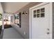Close up image of a well-designed exterior door with glass panels and modern black lighting fixtures at 104 Cleveland Ave, Albemarle, NC 28001