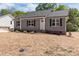 Charming single-story home with neat landscaping, fresh mulch, and a welcoming front porch at 104 Cleveland Ave, Albemarle, NC 28001