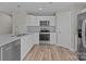Kitchen featuring white cabinets, stainless appliances, and granite countertops at 104 Cleveland Ave, Albemarle, NC 28001