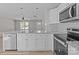 Spacious kitchen area with white cabinets, granite countertops, and stainless appliances at 104 Cleveland Ave, Albemarle, NC 28001