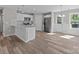 Bright kitchen featuring white cabinetry, stainless steel appliances, and granite countertops at 104 Cleveland Ave, Albemarle, NC 28001