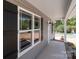 Inviting porch with large windows and stylish black shutters, creating a warm and welcoming entrance at 104 Cleveland Ave, Albemarle, NC 28001