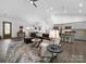 Open-concept living area featuring hardwood flooring and neutral tones at 11104 Pine Grove Ave, Mint Hill, NC 28227