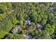 Aerial view of the property and surrounding neighborhood, showcasing lush greenery at 116 Anderson Farm Ct, Mooresville, NC 28117