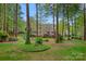 Spacious backyard featuring a playground and beautiful landscaping at 116 Anderson Farm Ct, Mooresville, NC 28117