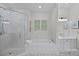 Elegant bathroom with a soaking tub, walk-in shower, and modern fixtures at 116 Anderson Farm Ct, Mooresville, NC 28117