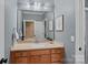Well lit bathroom featuring a framed mirror above the sink and a shower-tub combination at 116 Anderson Farm Ct, Mooresville, NC 28117