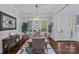 Formal dining room with hardwood floors, modern lighting, and elegant decor at 116 Anderson Farm Ct, Mooresville, NC 28117