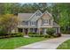 Inviting two-story home featuring manicured landscaping and a welcoming front porch at 116 Anderson Farm Ct, Mooresville, NC 28117